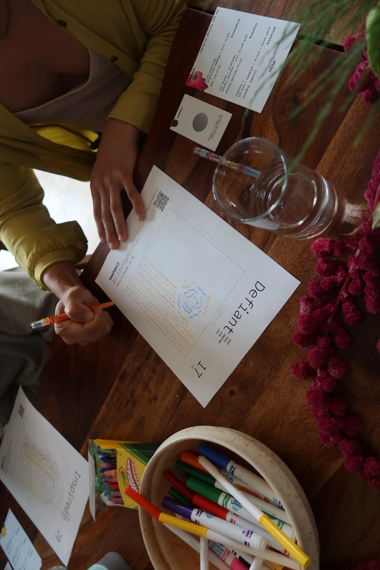 A participant’s drawing on the Defiant worksheet, beside the menu and a Chroma scratch card.
