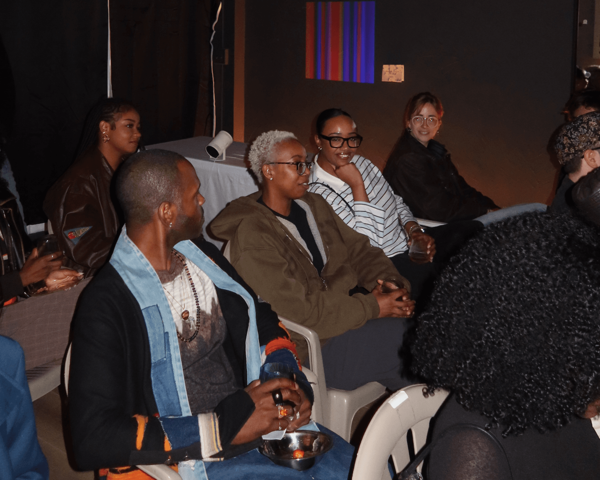 Visitors gathered in conversation inside the ACG activation